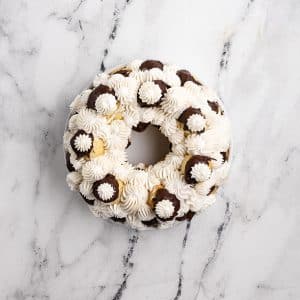 profiteroles with cream between them.