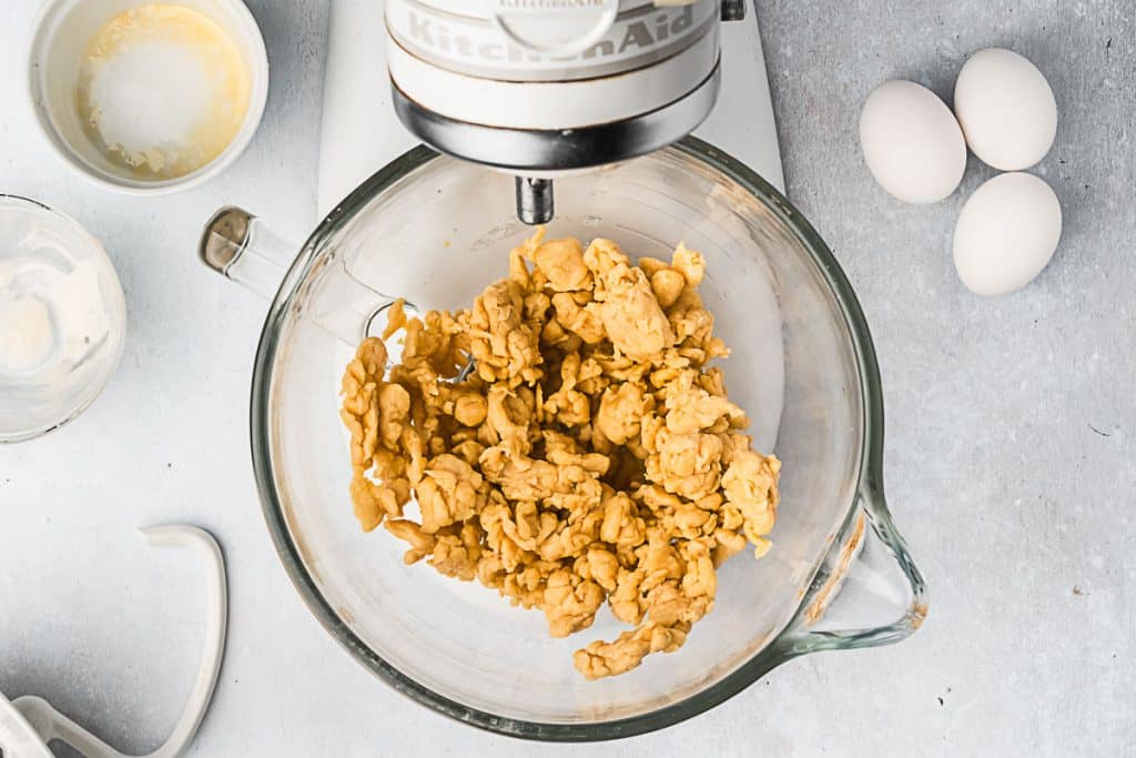Dough coming together in a mixer.