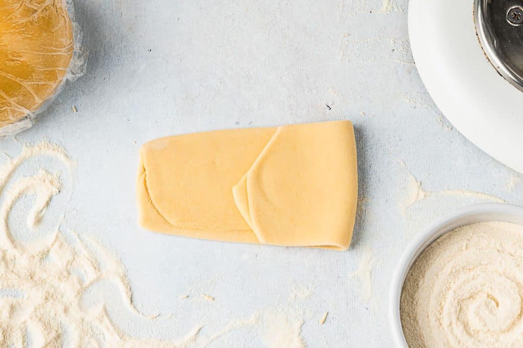 Fold dough into thirds.