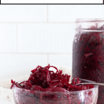 Beet sauerkraut in a bowl and jar.