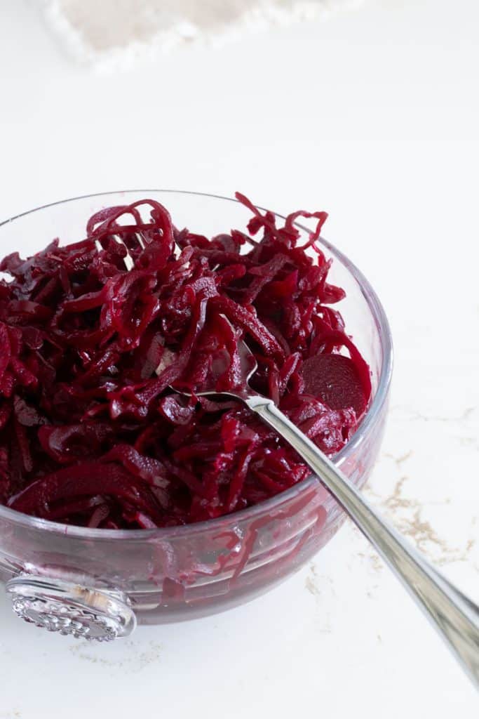 Beet Sauerkraut in a glass bowl.