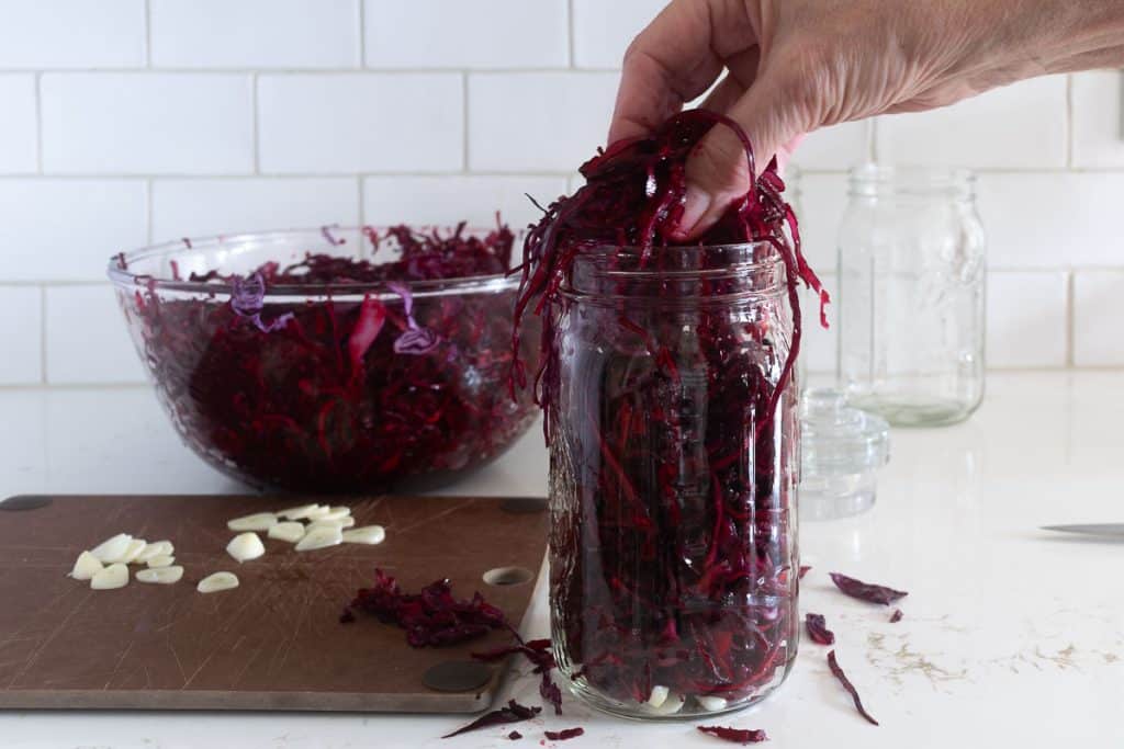 Massaged cabbage and beets into jars.