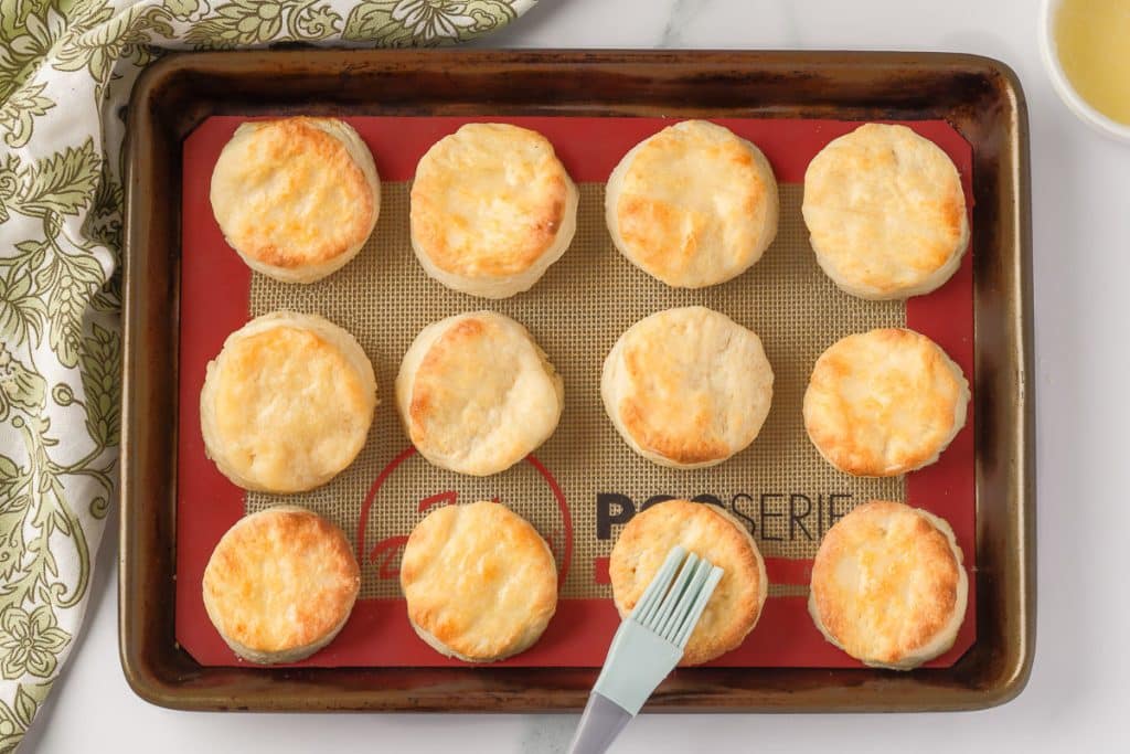 Baked sourdough discard biscuits with butter.
