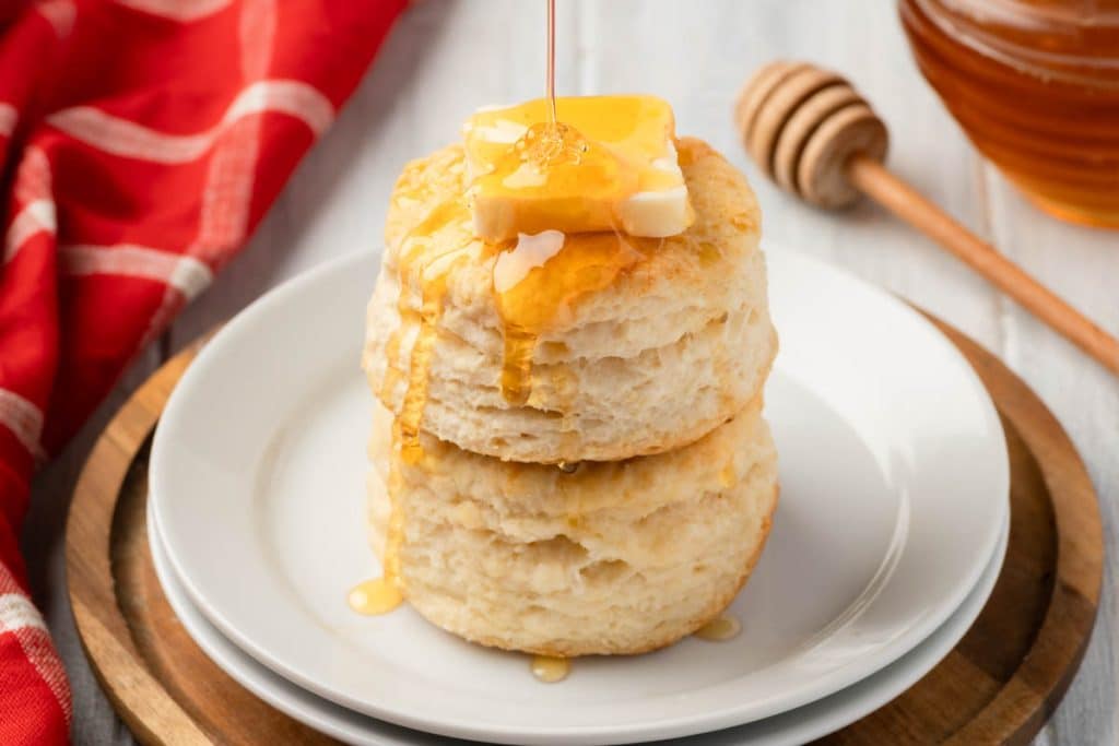Buttermilk biscuits with butter and honey.