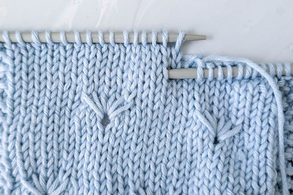Place your needle 3 stitches down, on the 2nd stitch to the left.