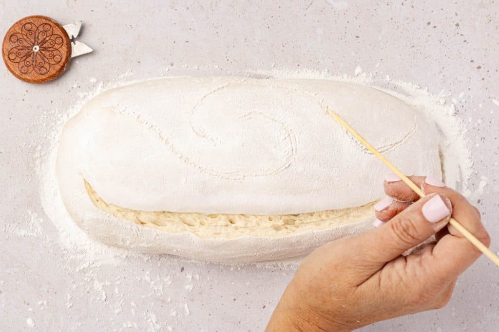 Making swirl design with skewer.
