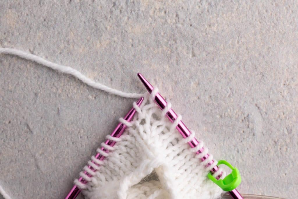 Showing how to lift a stitch.