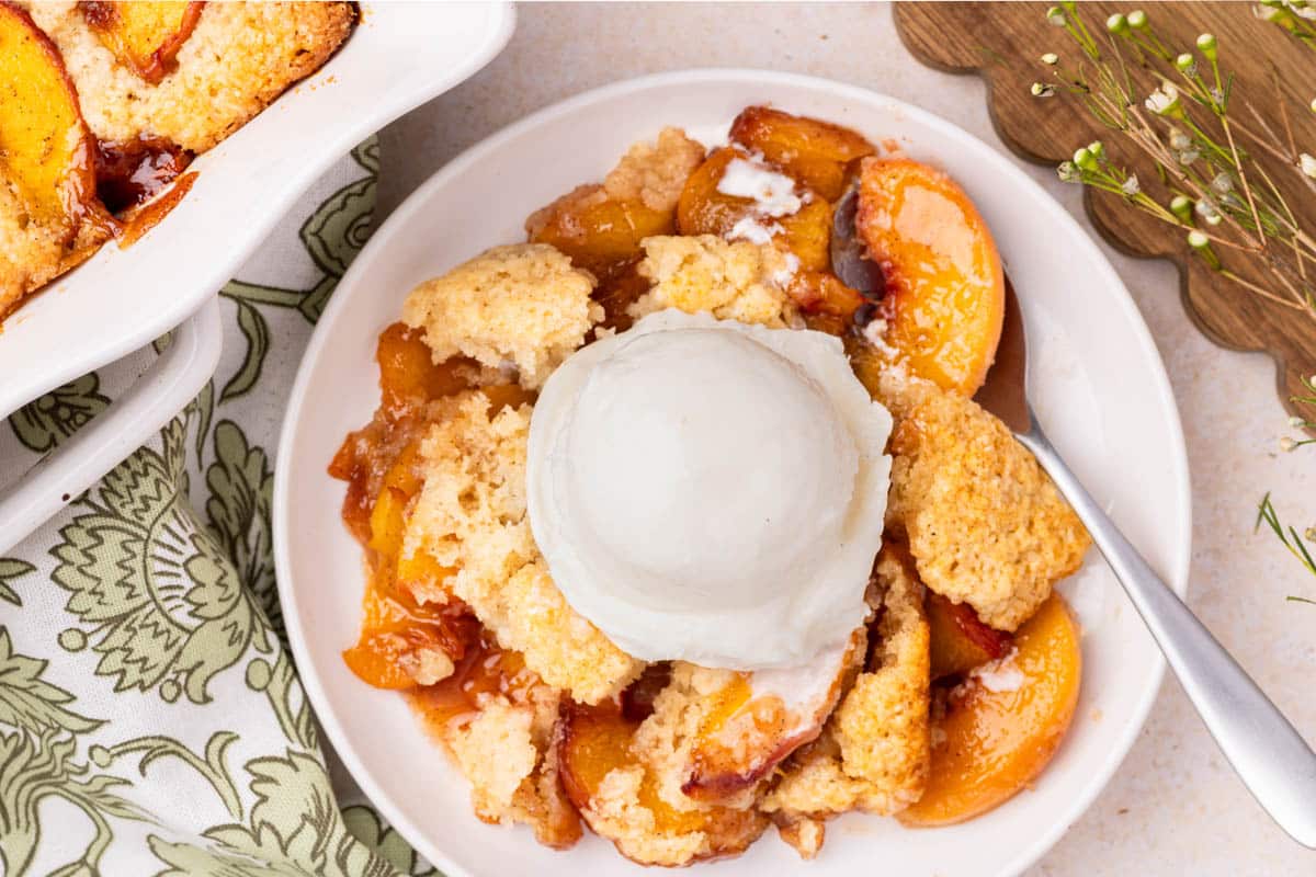 Peach cobbler with ice cream.