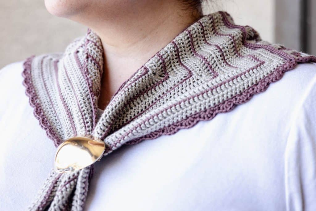 Finished Crosshatch Trellis Crochet Scarf being worn around the neck of a woman.