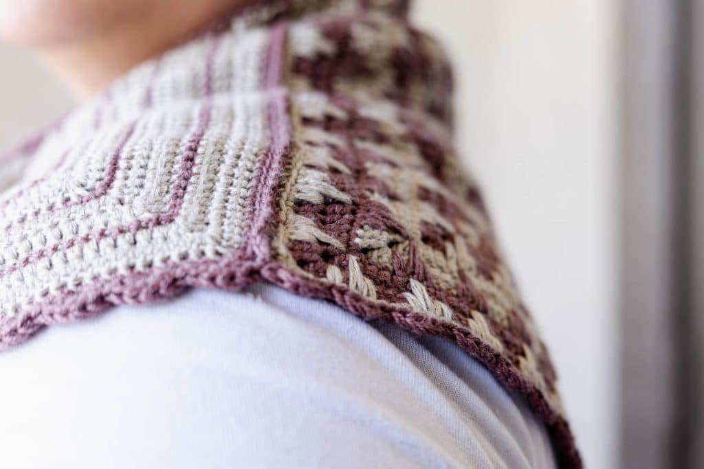 Finished Crosshatch Trellis Crochet Scarf being worn around the neck of a woman.