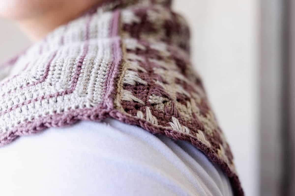 Finished Crosshatch Trellis Crochet Scarf being worn around the neck of a woman.