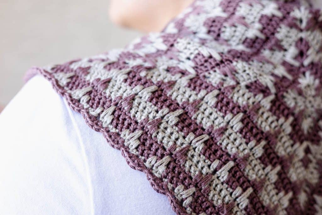Finished Crosshatch Trellis Crochet Scarf being worn around the neck of a woman.