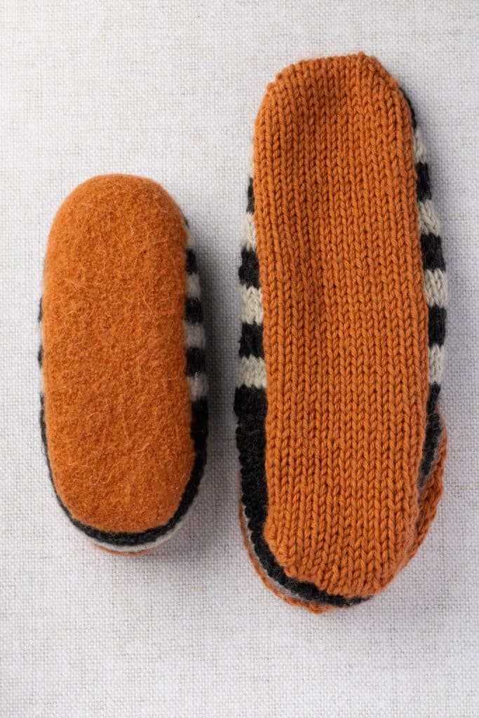 Bottom of felted and unfelted slippers.